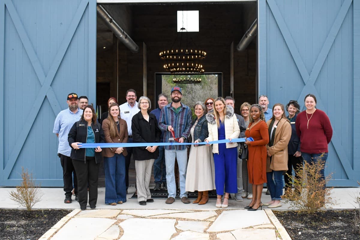 Ribbon cutting at a charming barn-style event venue